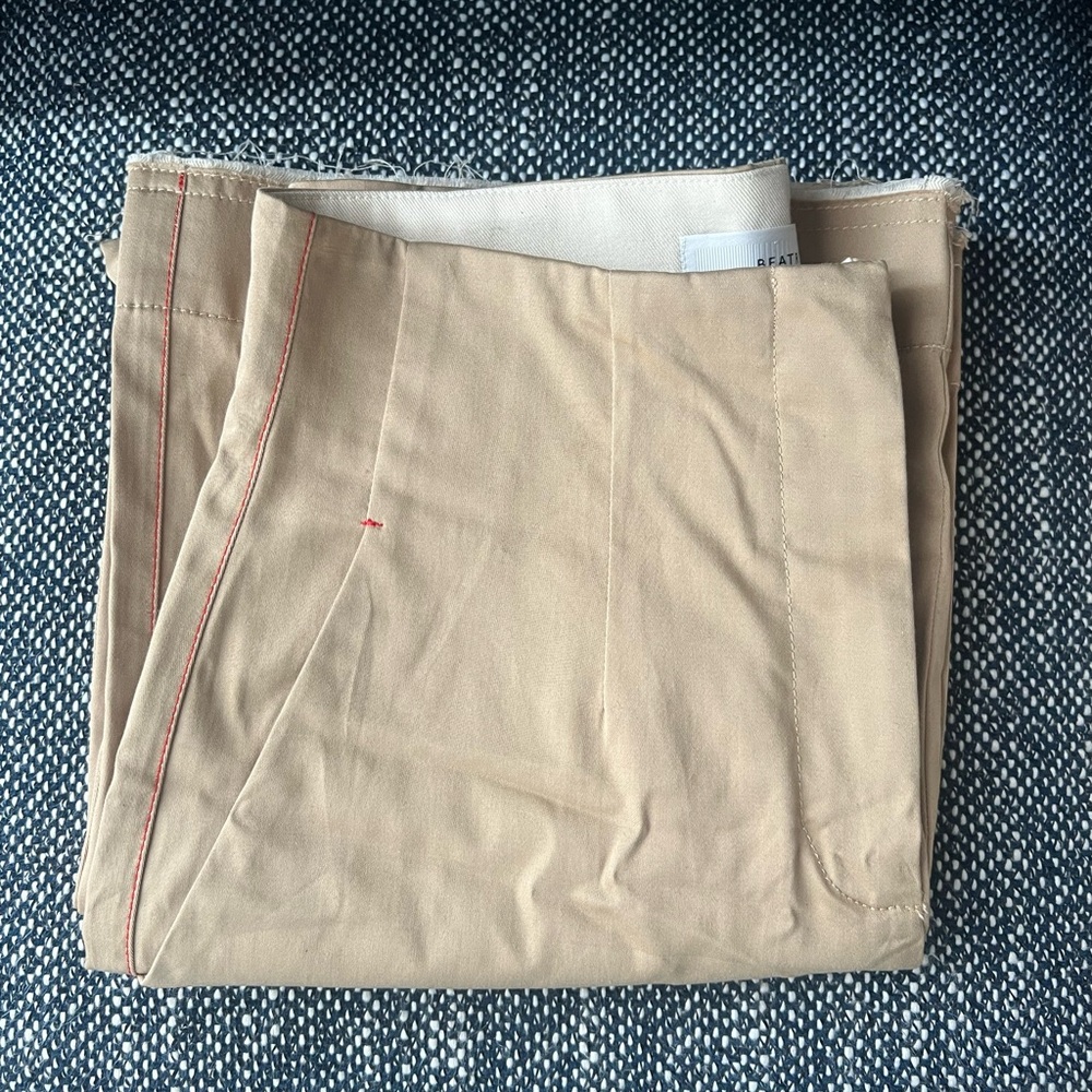 100% cotton High-waisted wide leg khaki pants with a stunning contrast red trim.